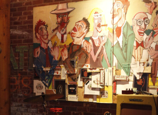 mixed media of night life and people with glasses of wine on a brick wall